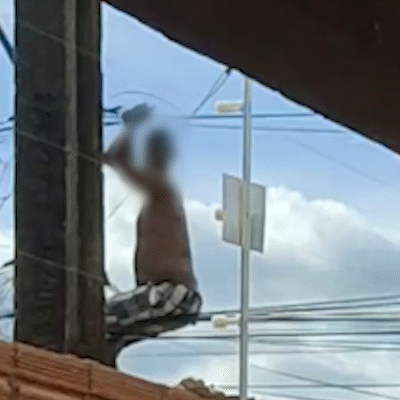 Homem é flagrado pendurado em fios para furtar energia