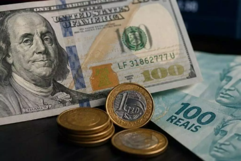 Dólar fecha em queda a R$ 5,10 após taxa de juros cair para 14%