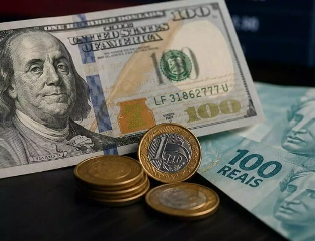 Dólar fecha em queda a R$ 5,10 após taxa de juros cair para 14%